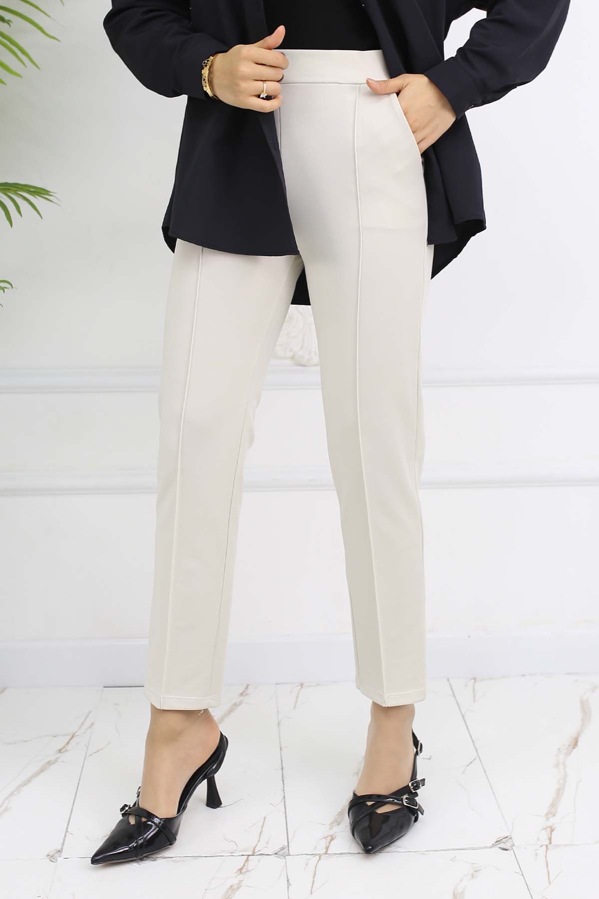 Carrot Trousers With Double Button Detail And Pockets